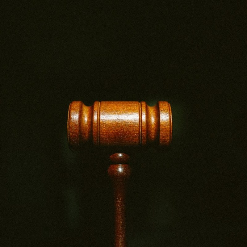 brown wooden stand with black background